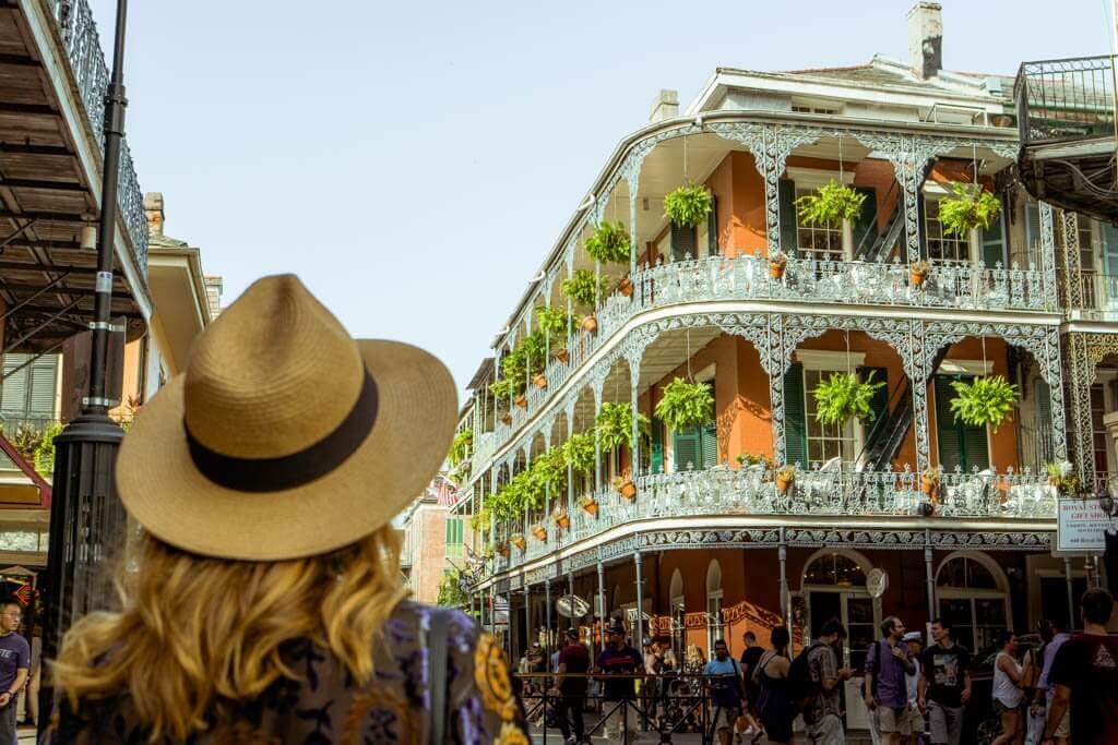 https://www.boboandchichi.com/wp-content/uploads/Megan-looking-at-one-of-the-beautiful-buildings-in-the-French-Quarter-of-New-Orleans.jpg